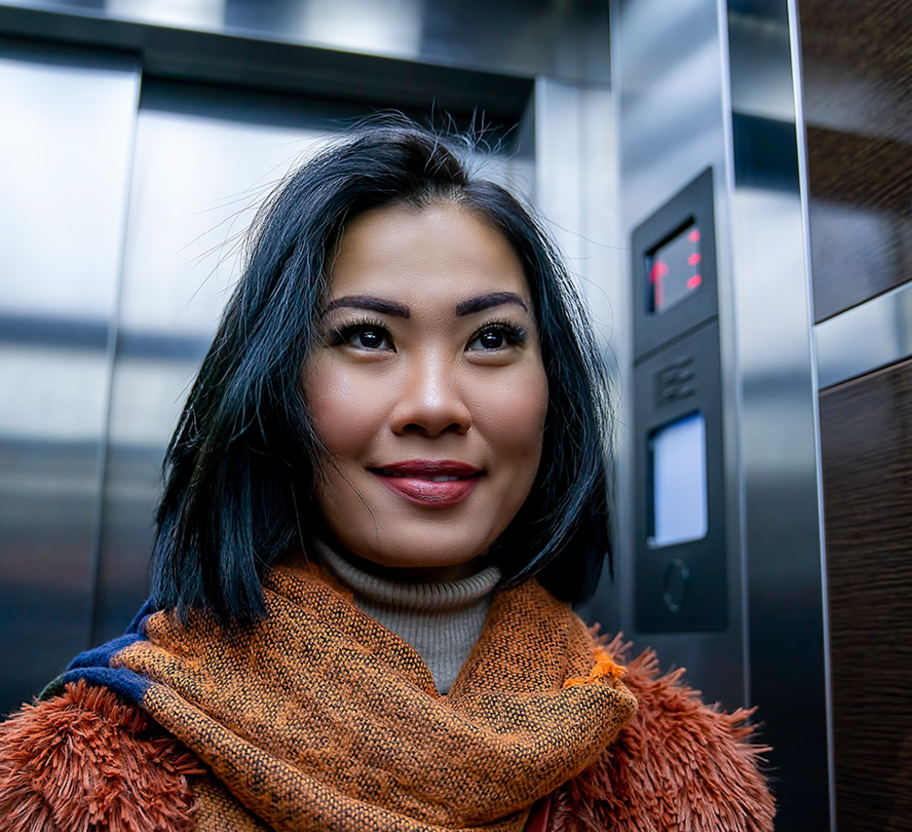 Woman waiting in elevator